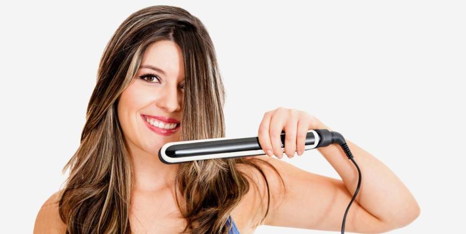 woman with hair strightener