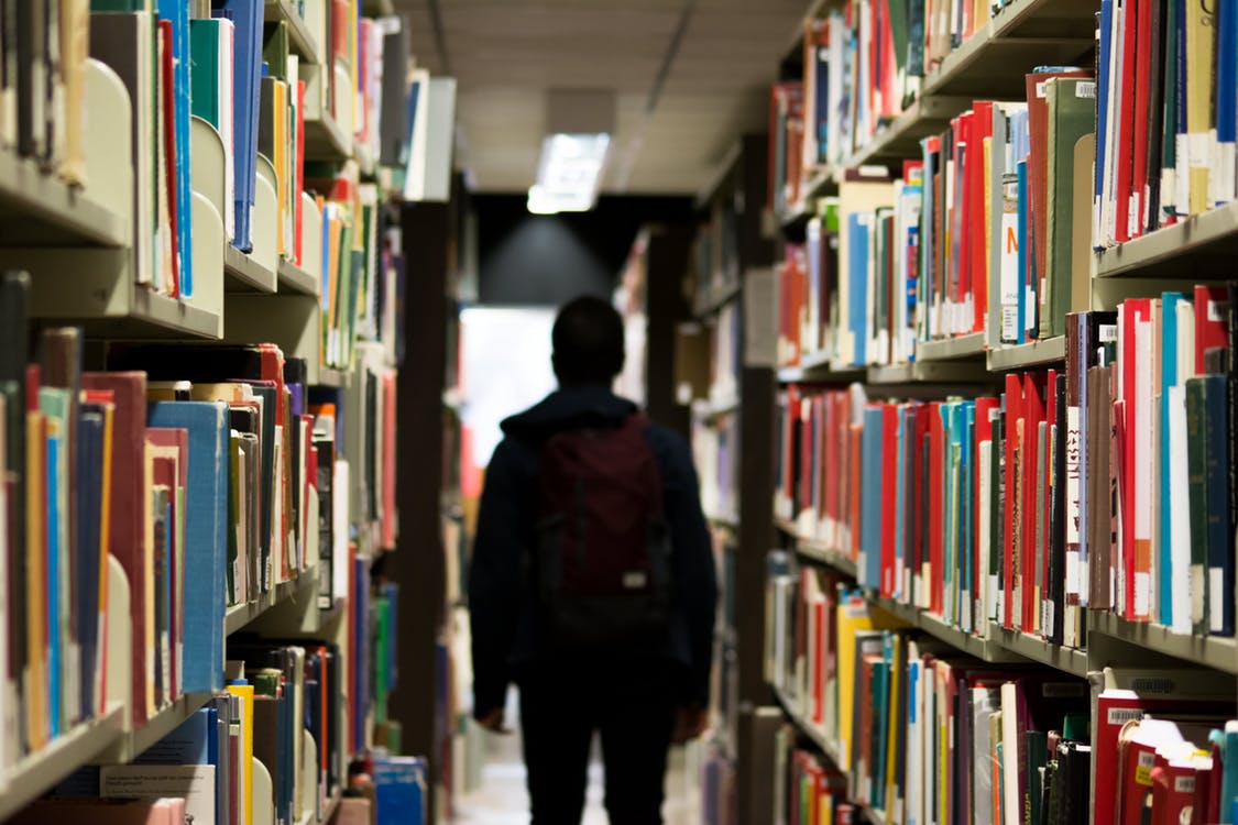 man in library